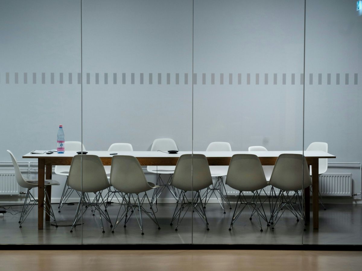 Empty boardroom — the space where leadership pressure builds